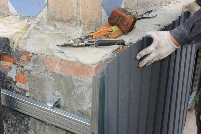 Gresham house foundation wall repair by a worker